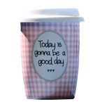 A checkered reusable coffee mug that says 